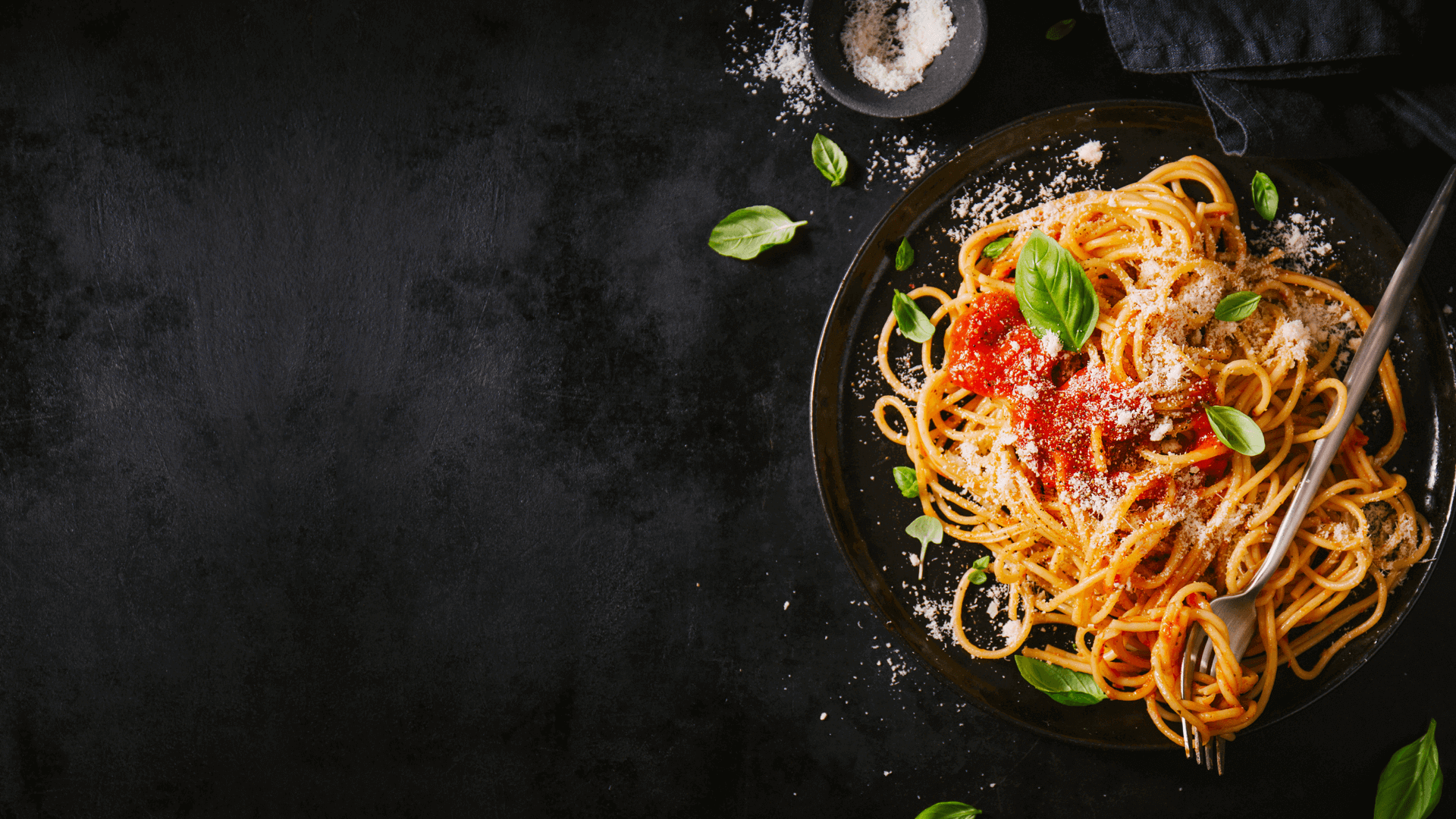 A prepared meal photographed on a dark surface